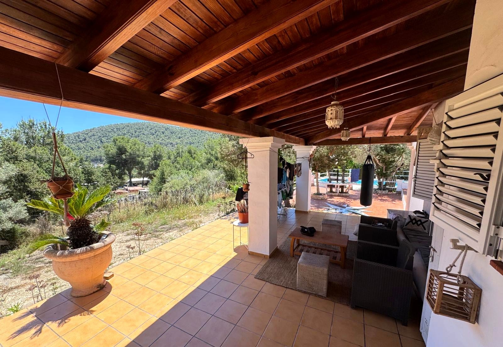 Covered terrace looking out over the olive grove and hills